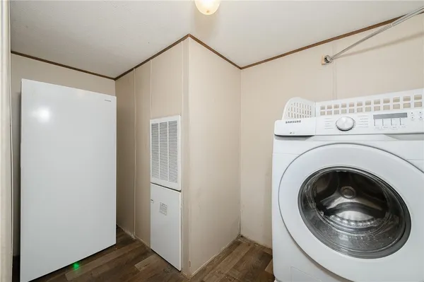 a bathroom with a granite countertop sink a toilet and a mirror