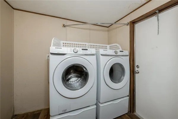a utility room with dryer and washer