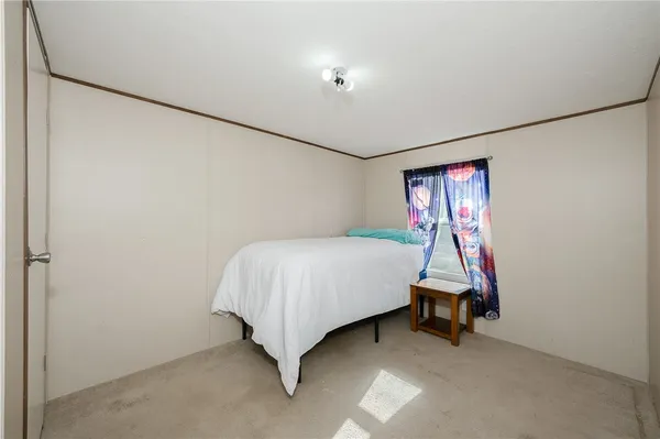 a bedroom with a bed and a cabinets