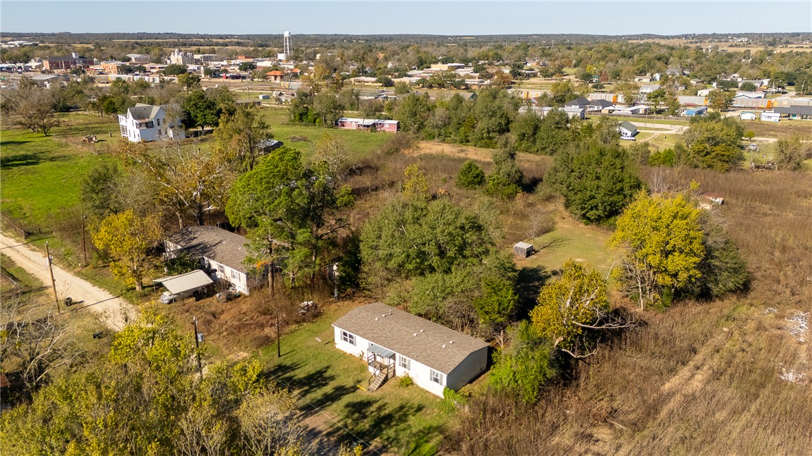 604 Sanders Rd. Lane Franklin, TX 77856 - Photo 34 of 42 an aerial view of residential houses with outdoor space