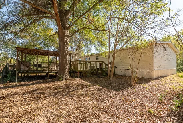 a house view with a backyard space