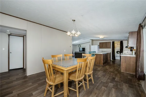 a kitchen with a sink a counter top space stainless steel appliances and cabinets