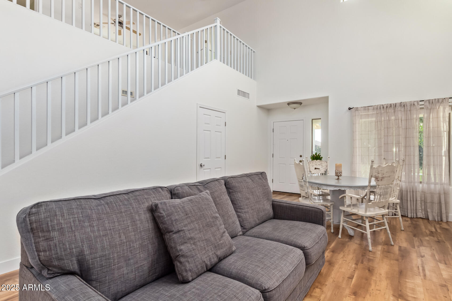 45360 West Desert Garden Road Maricopa, AZ 85139 - Photo 11 of 42 a living room with furniture and wooden floor