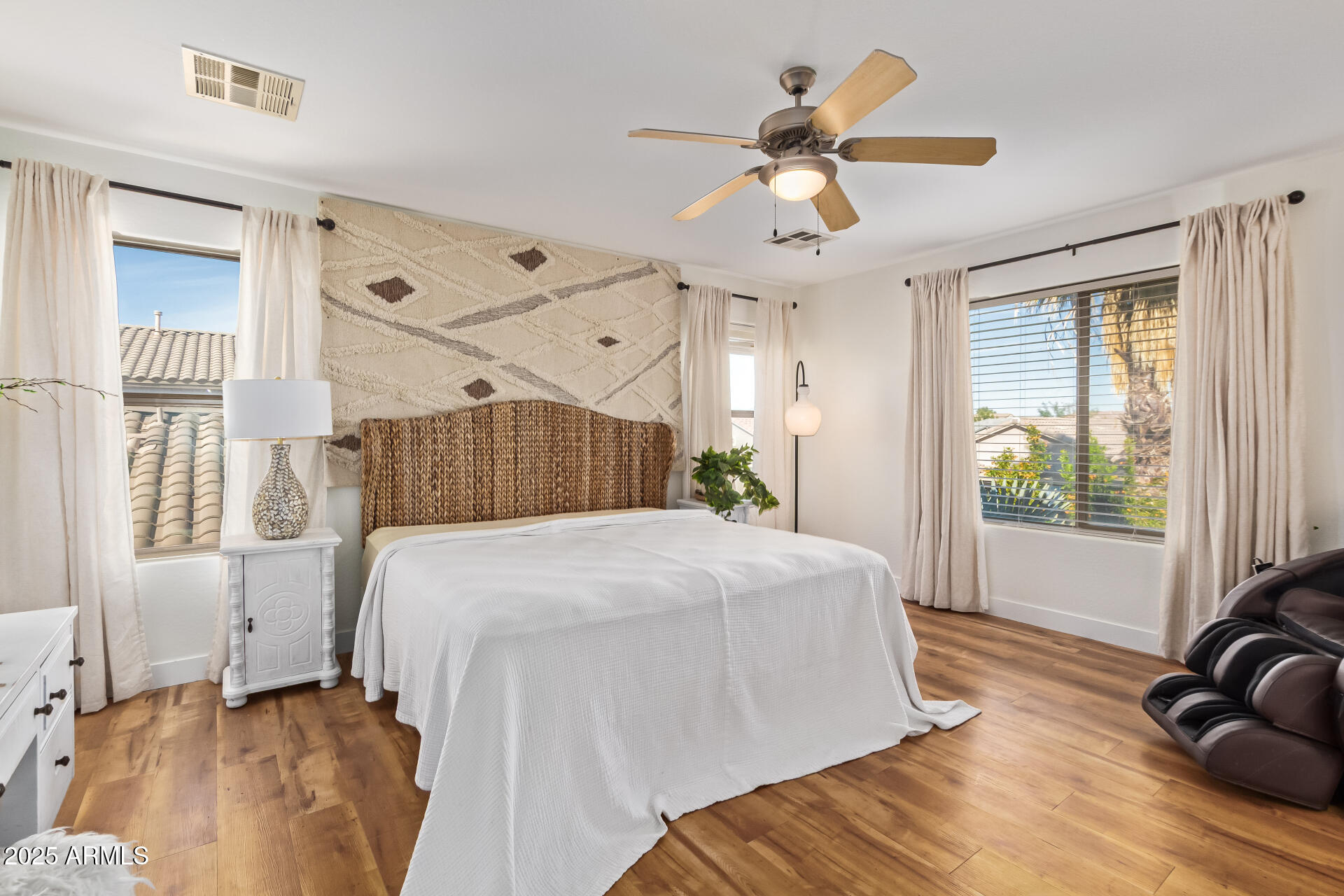 45360 West Desert Garden Road Maricopa, AZ 85139 - Photo 19 of 42 a spacious bedroom with a bed and a window