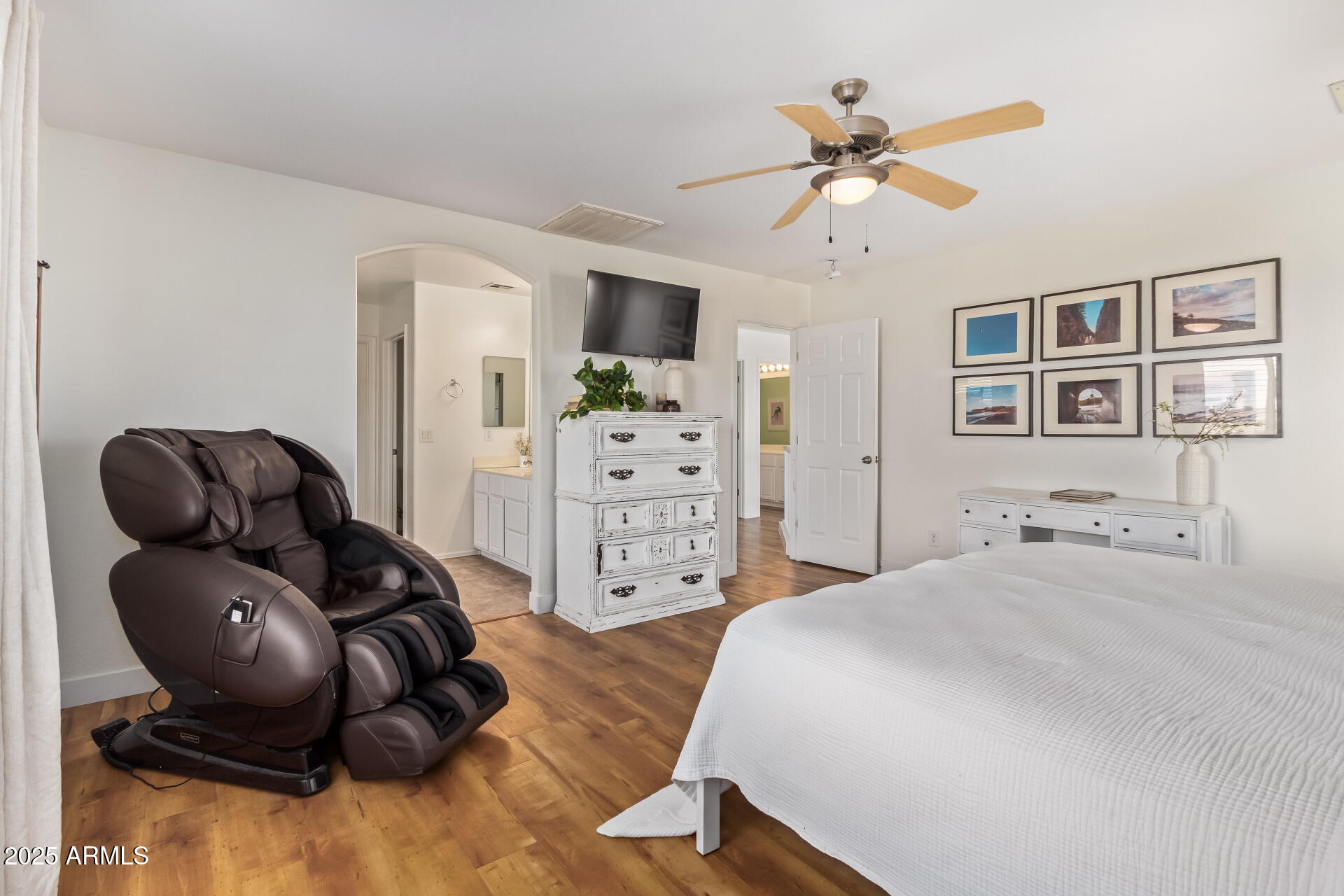 45360 West Desert Garden Road Maricopa, AZ 85139 - Photo 20 of 42 a spacious bedroom with a bed and cabinets