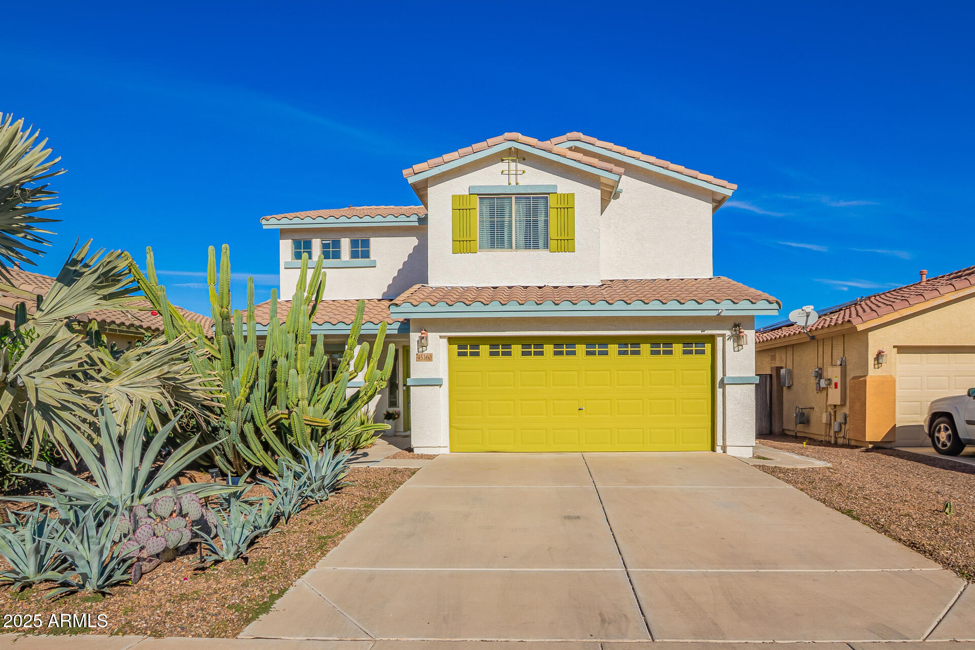 45360 West Desert Garden Road Maricopa, AZ 85139 - Photo 2 of 42 a front view of a house with a yard