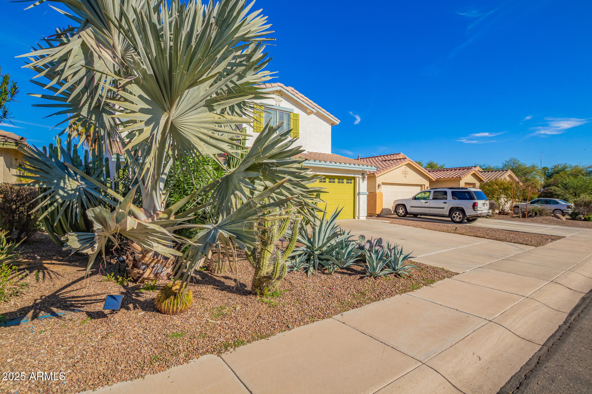 45360 West Desert Garden Road Maricopa, AZ 85139 - Photo 3 of 42 a view of multiple houses with a yard