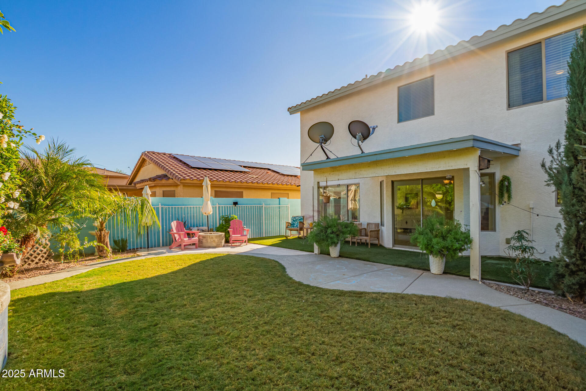 45360 West Desert Garden Road Maricopa, AZ 85139 - Photo 41 of 42 a view of a white house with a big yard and potted plants