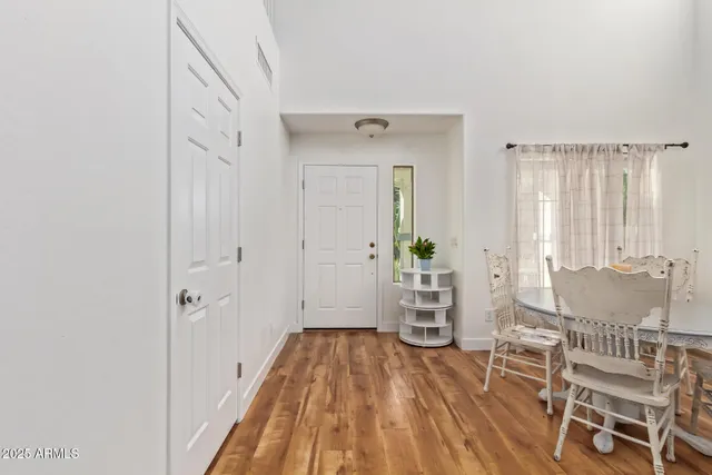 a view of an entryway with wooden floor