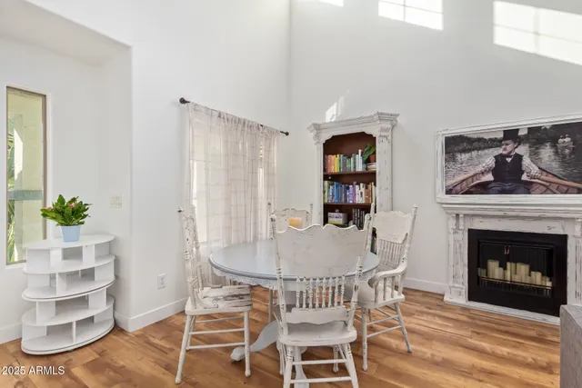 a dining room with furniture and a fireplace