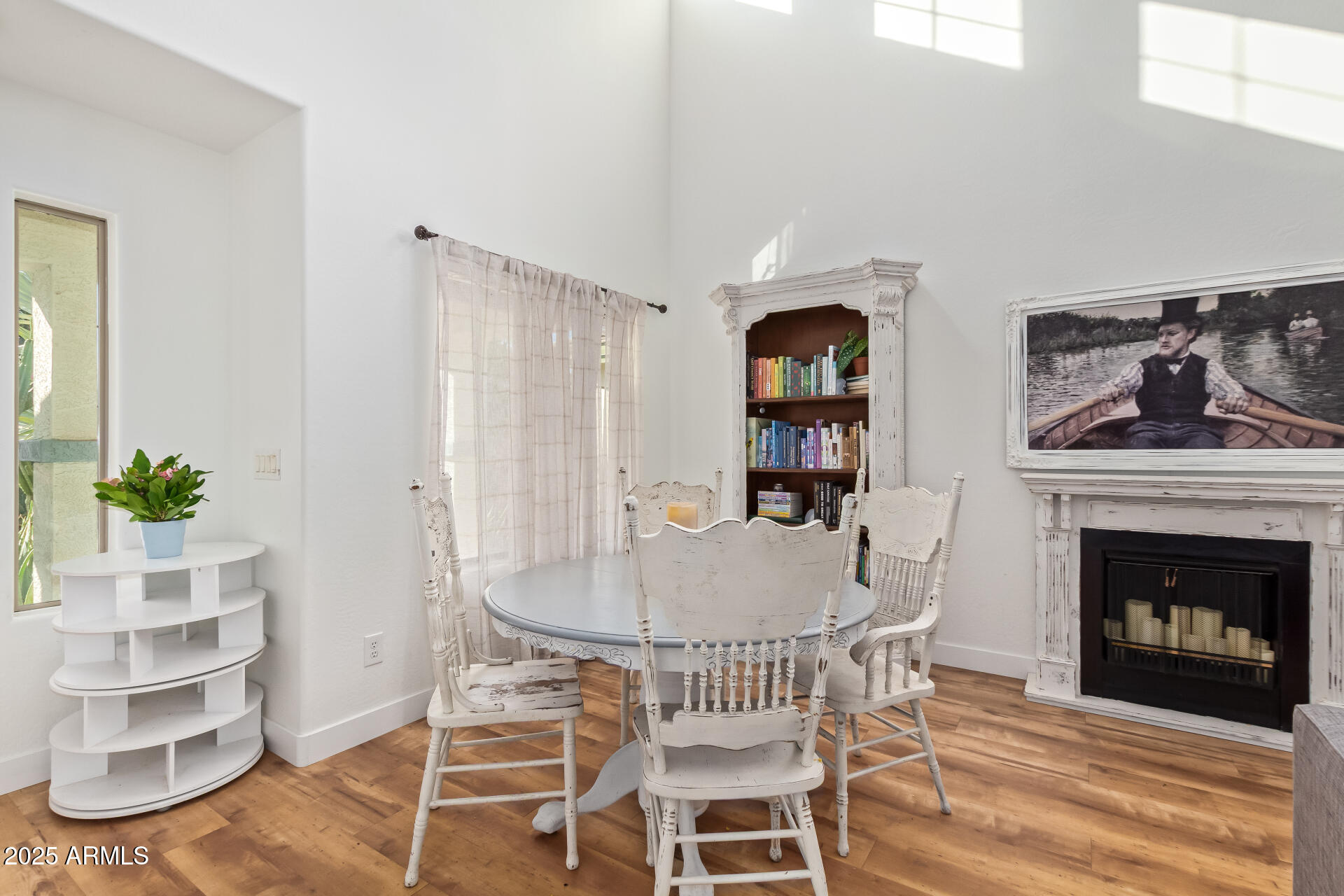 45360 West Desert Garden Road Maricopa, AZ 85139 - Photo 8 of 42 a dining room with furniture and a fireplace