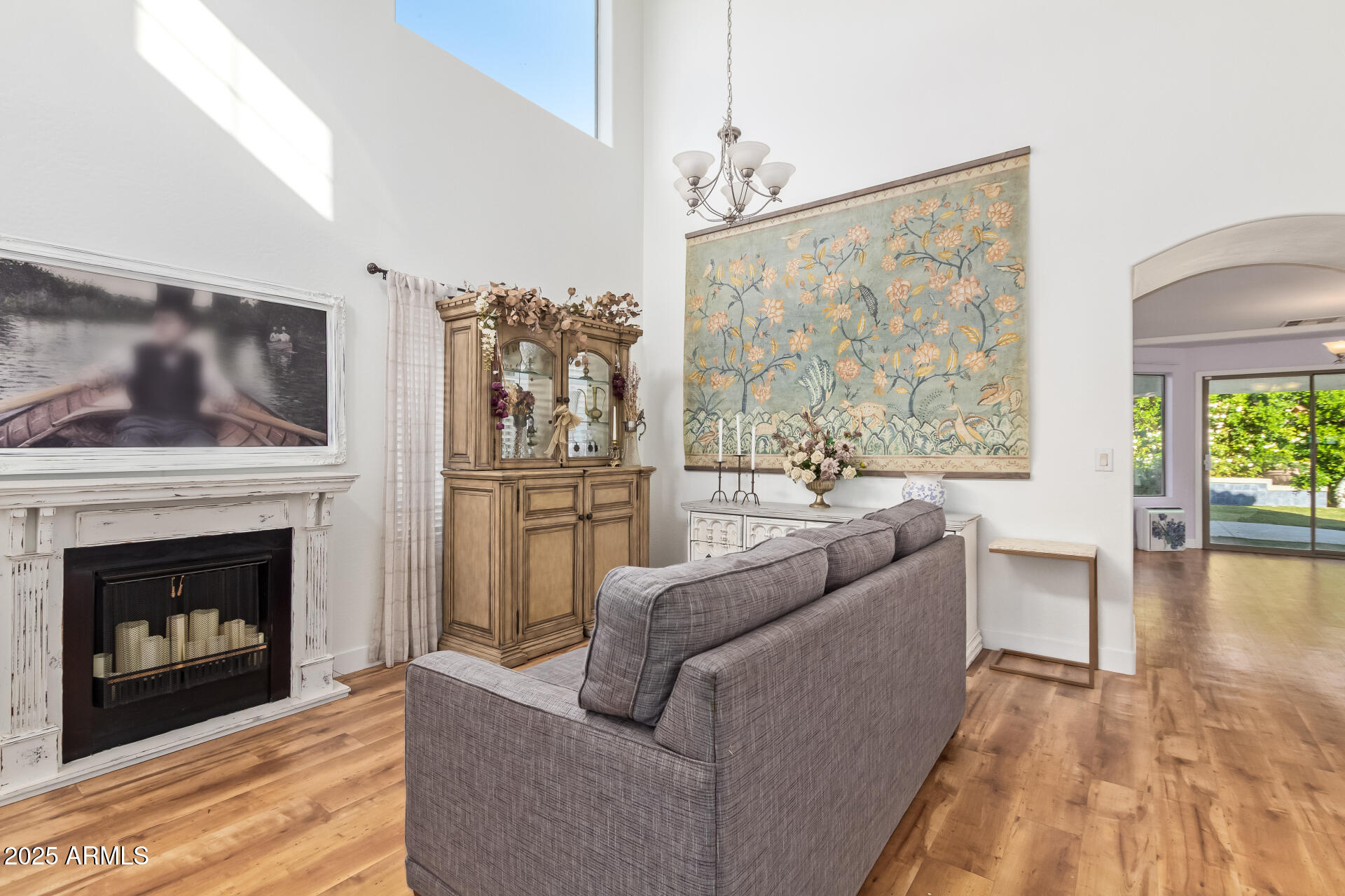 45360 West Desert Garden Road Maricopa, AZ 85139 - Photo 9 of 42 a living room with furniture and a fireplace