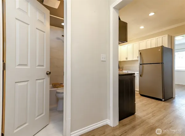 a view of a kitchen with a refrigerator