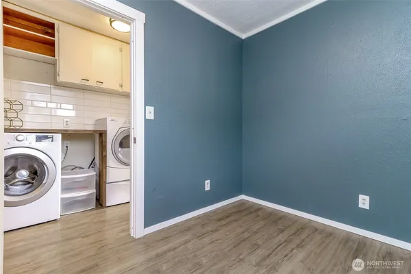 a view of a storage & utility room with washer and dryer
