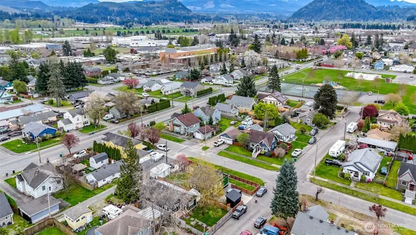 an aerial view of residential houses with outdoor space