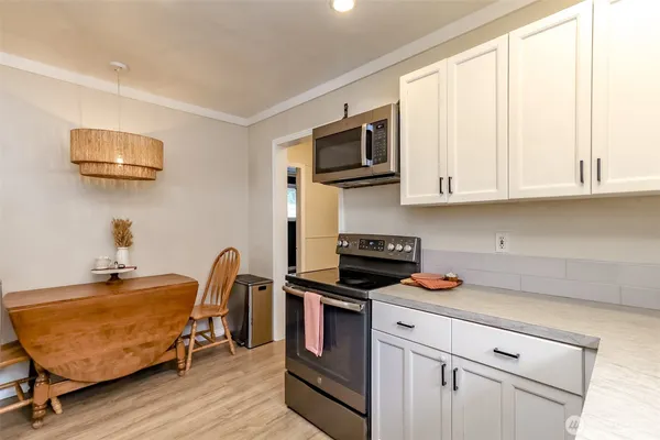 a kitchen with a stove and a microwave