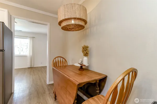 a dining room with furniture and window