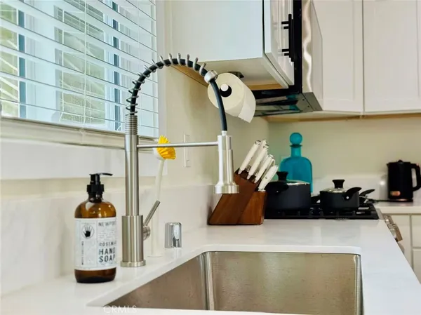 a table with wine bottles and glasses on it