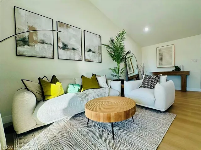 a living room with furniture and a lamp