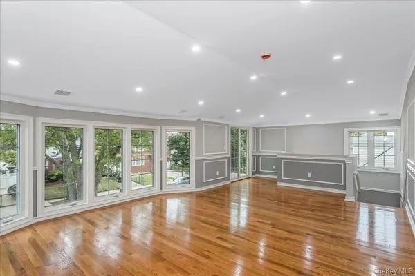 a kitchen with kitchen island stainless steel appliances a sink a stove a microwave and cabinets