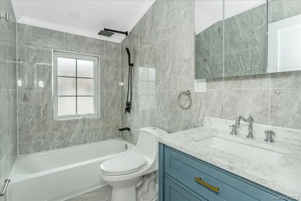 an empty room with a refrigerator and washer dryer
