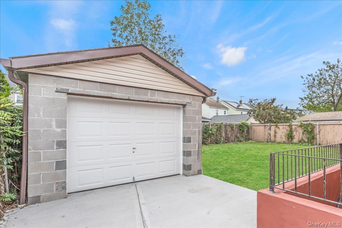 243-36 Caney Road Queens, NY 11422 - Photo 29 of 30 a view of a backyard with a garden