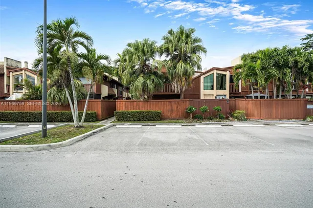 a view of a backyard with a tree