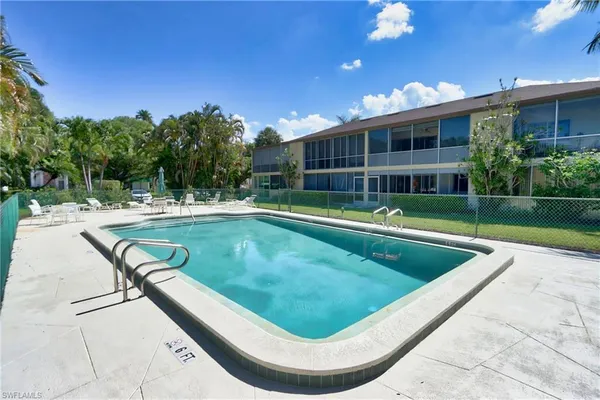 a view of a swimming pool with a patio