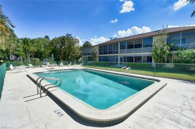 a view of a swimming pool with a patio