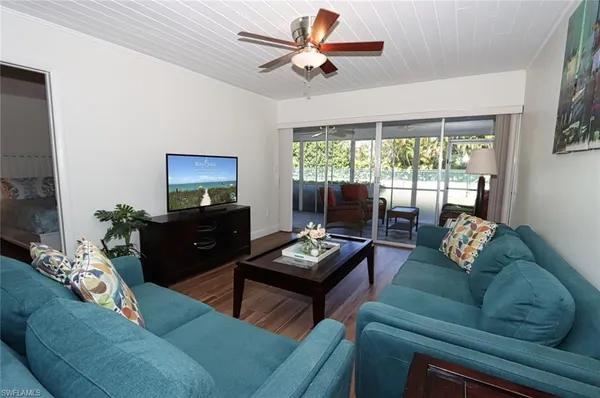 a living room with furniture and a flat screen tv