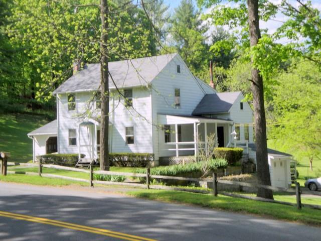 8 Merryall Road New Milford, CT 06776 - Photo 1 of 1 a front view of a house with a yard