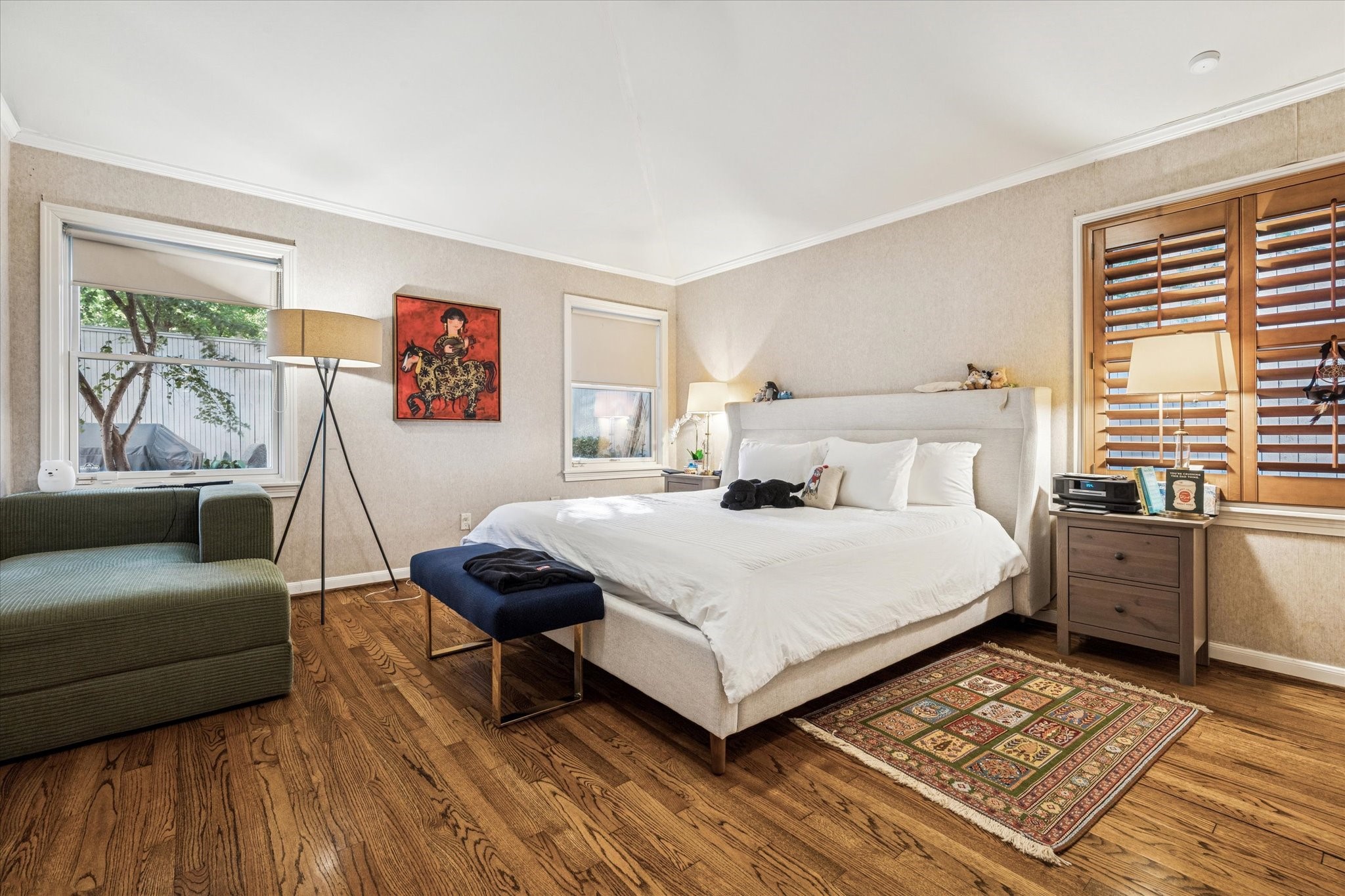 2401 Maconda Lane Houston, TX 77027 - Photo 10 of 20 The PRIMARY BEDROOM (15 X 14) features hardwood flooring, painted walls, crown/base molding, shuttered windows, 2 windows with shades, dual closets.
