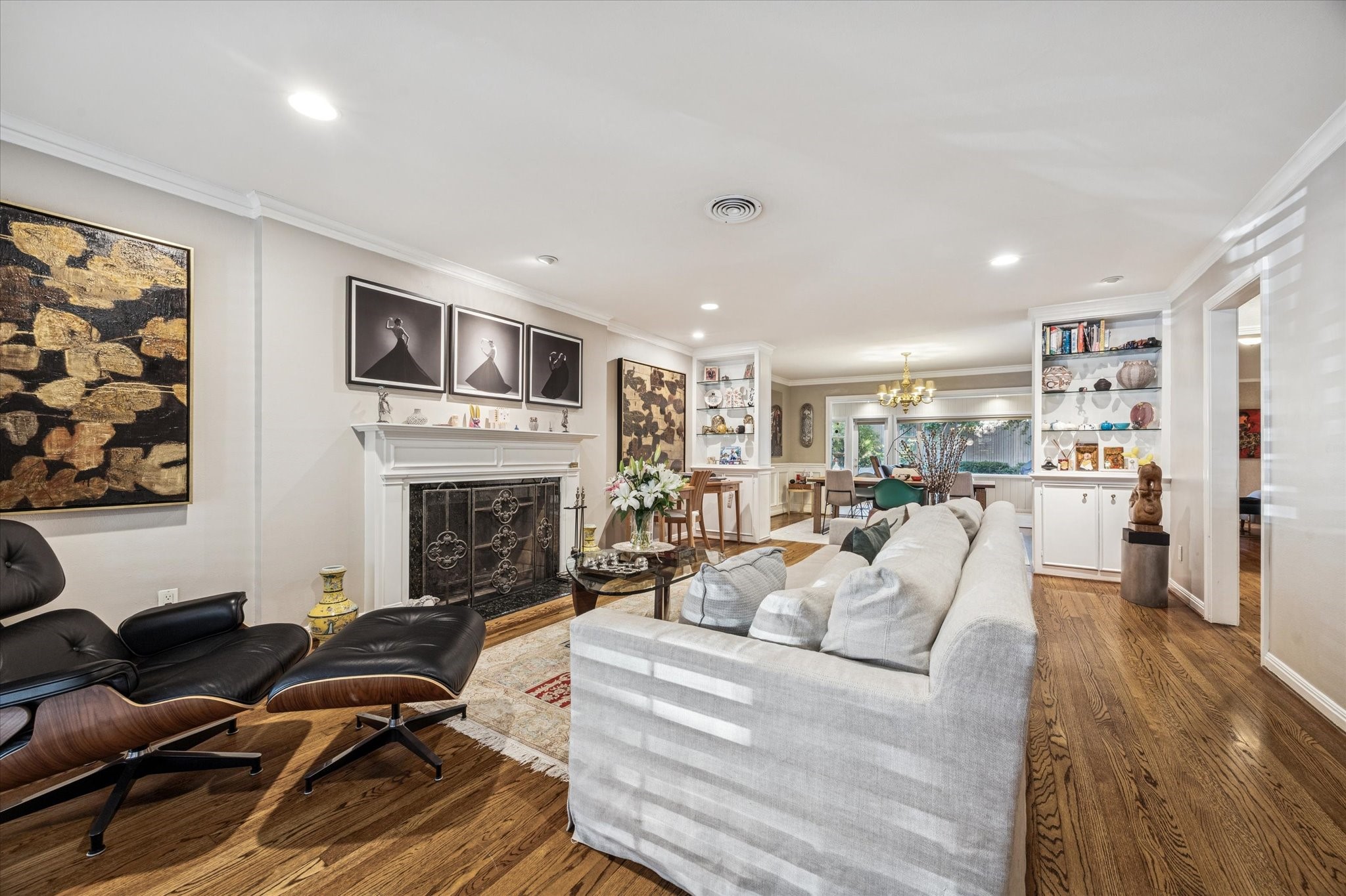 2401 Maconda Lane Houston, TX 77027 - Photo 19 of 20 Another view of the Living Room shown from the Front Entry door looking toward the DINING ROOM (15 X 10) with its built-in glass display shelving. A great floor plan with an easy flow from one entertaining area to another!