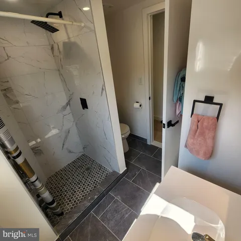 a bathroom with a sink and shower