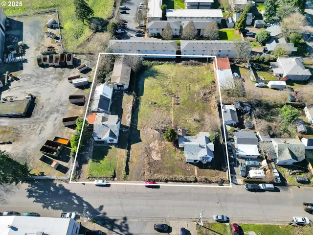 an aerial view of houses with outdoor space