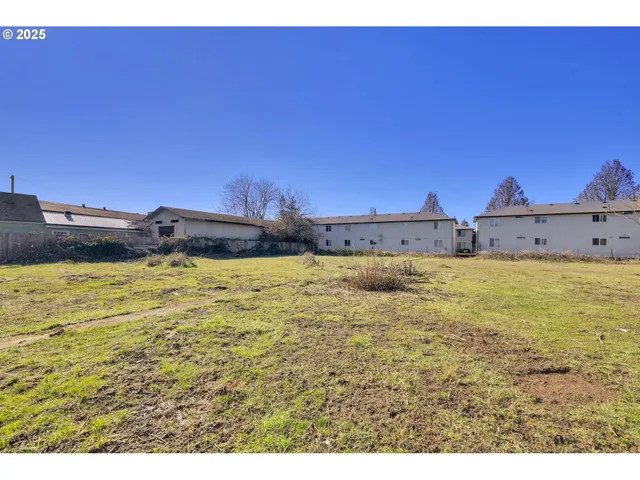 a bathroom with a black white checkered floor