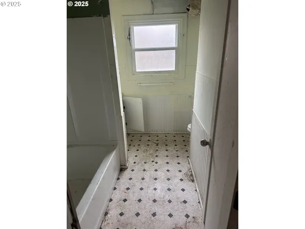 a view of a hallway with windows