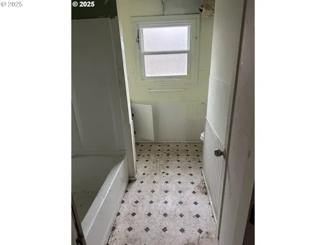 a view of a hallway with windows