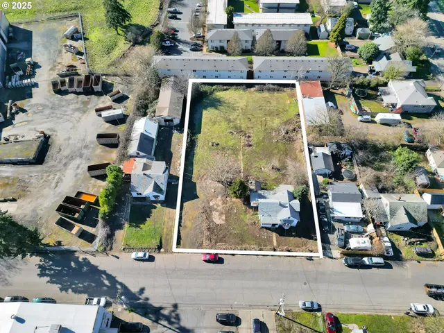 an aerial view of houses with outdoor space