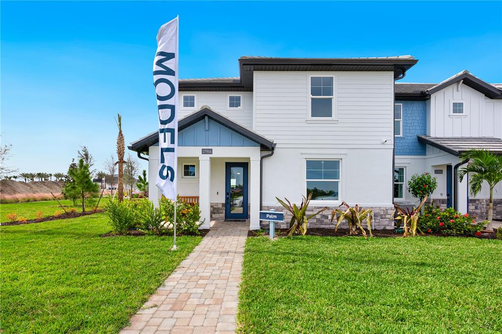 17966 Broadleaf Loop Venice, FL 34293 - Photo 1 of 19 a front view of a house with garden