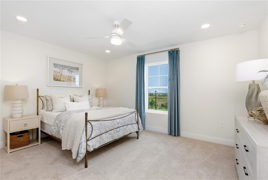 17966 Broadleaf Loop Venice, FL 34293 - Photo 15 of 19 a bedroom with a bed and a painting