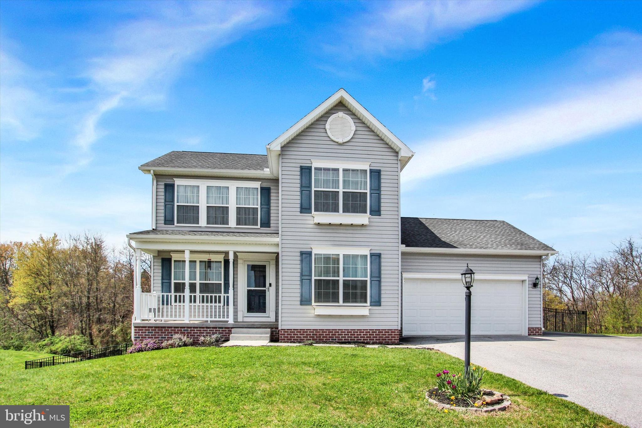 88 Clover Run Abbottstown, PA 17301 - Photo 1 of 15 a front view of a house with a yard