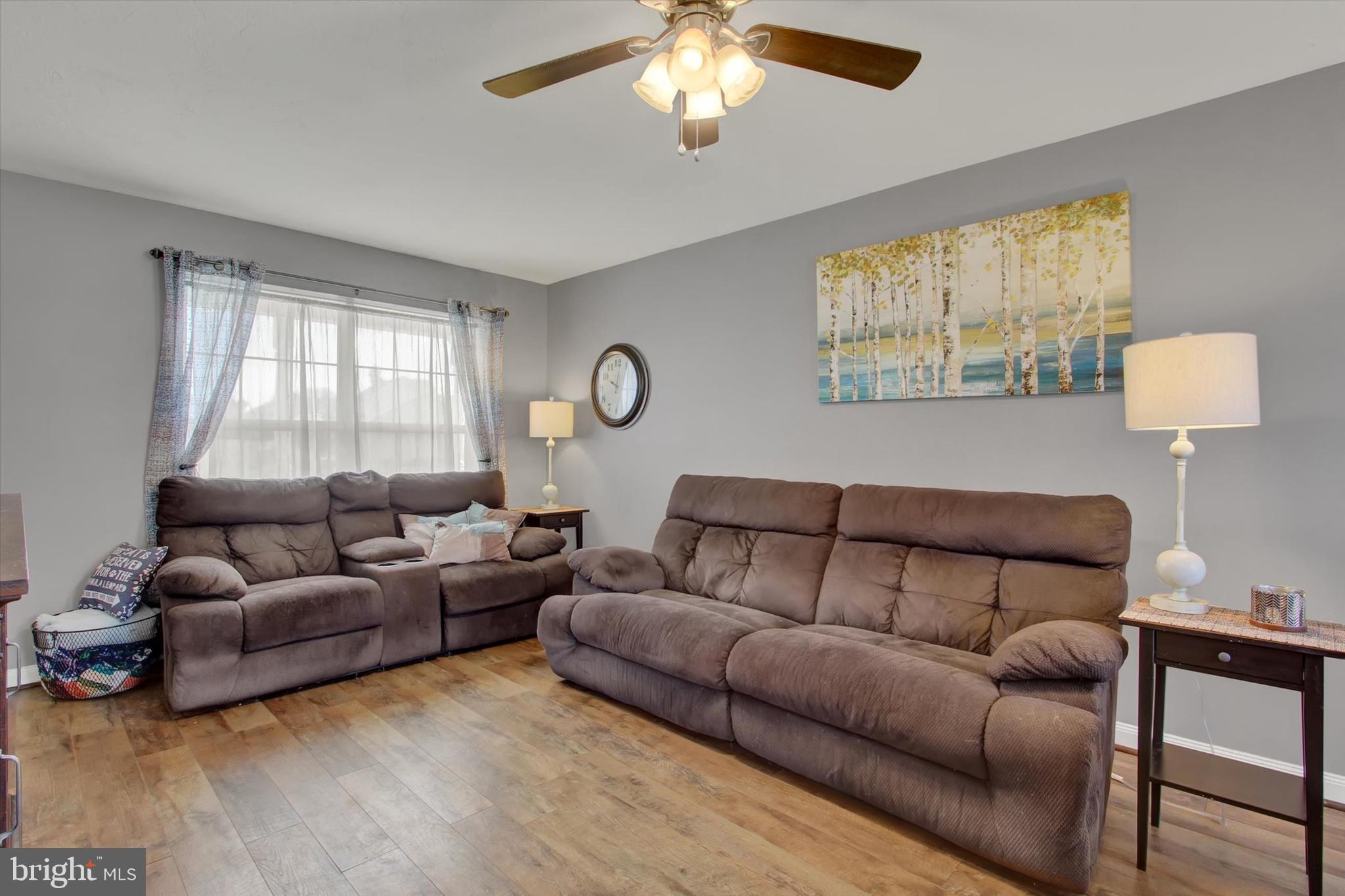 88 Clover Run Abbottstown, PA 17301 - Photo 3 of 15 a living room with furniture a large window and a lamp