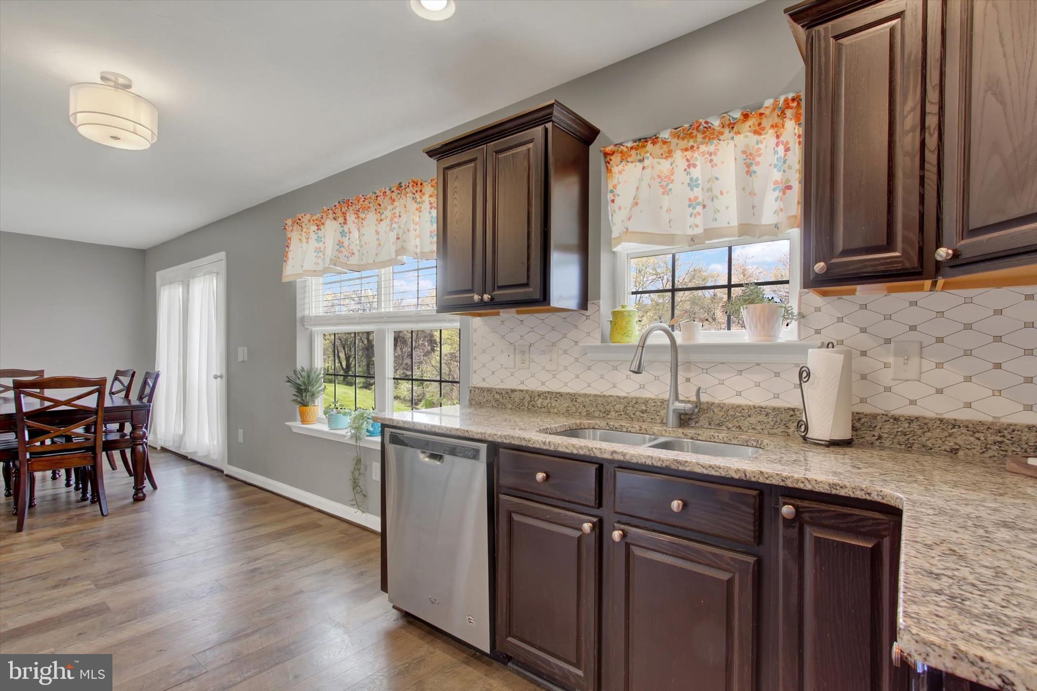 88 Clover Run Abbottstown, PA 17301 - Photo 4 of 15 a kitchen with granite countertop a sink a counter top space and cabinets