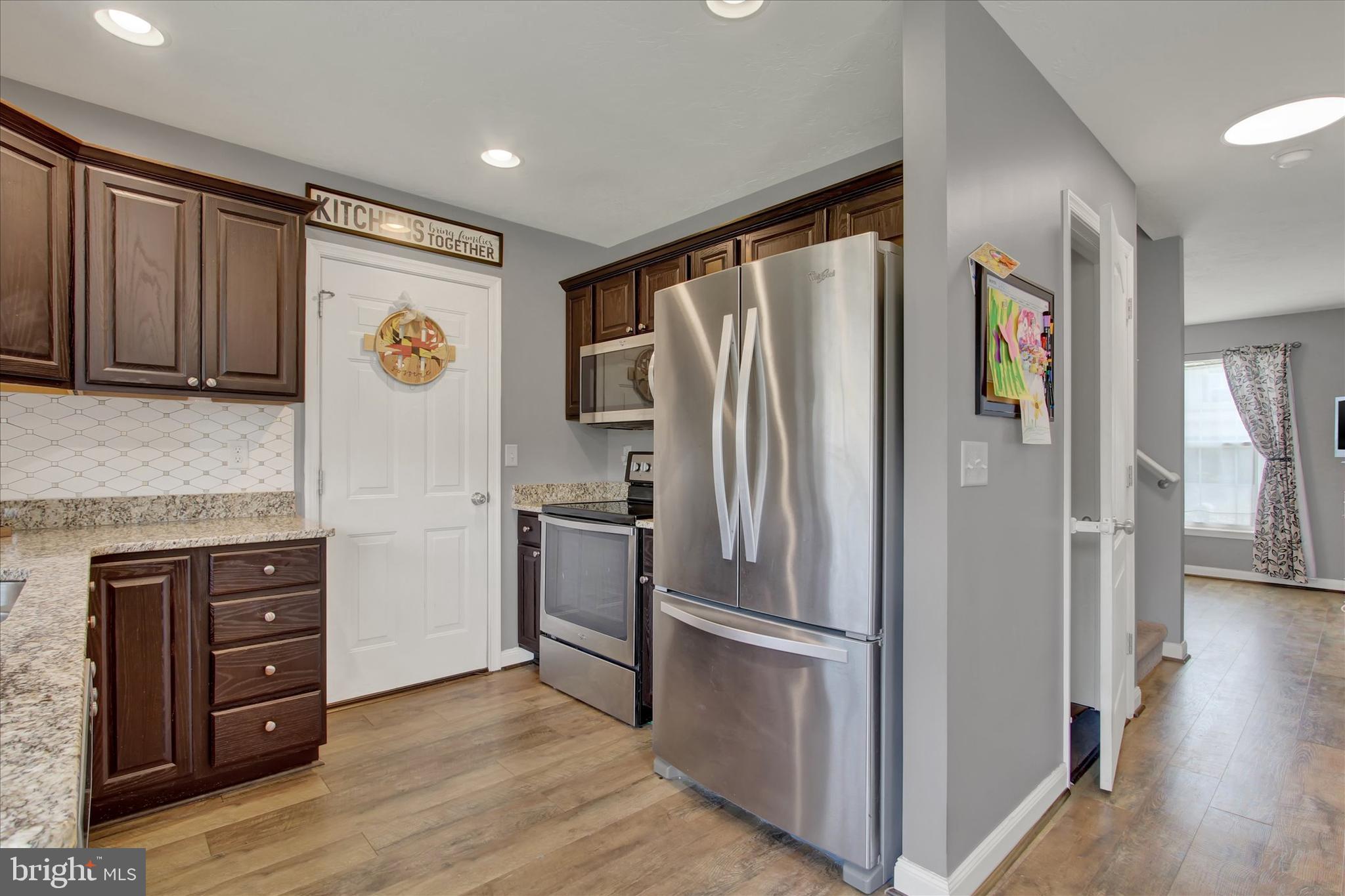 88 Clover Run Abbottstown, PA 17301 - Photo 5 of 15 a kitchen with stainless steel appliances granite countertop a refrigerator and a stove