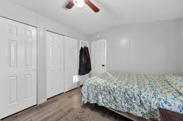 a bedroom with a bed and a walk in closet