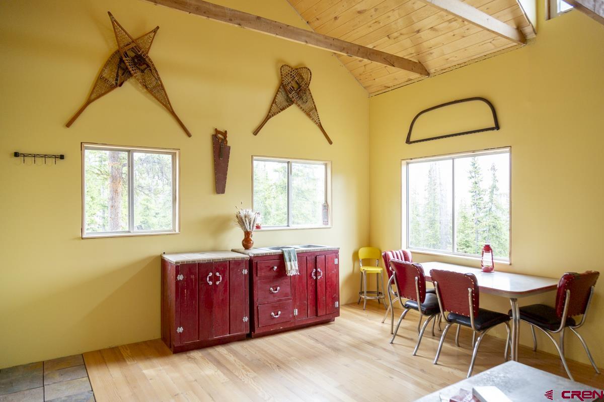 3190 Forest Road, Unit 503 Creede, CO 81130 - Photo 2 of 22 a view of a dining room with furniture and window