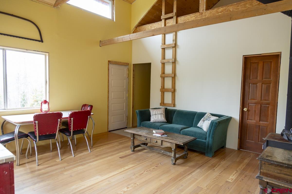 3190 Forest Road, Unit 503 Creede, CO 81130 - Photo 5 of 22 a living room with furniture and a window