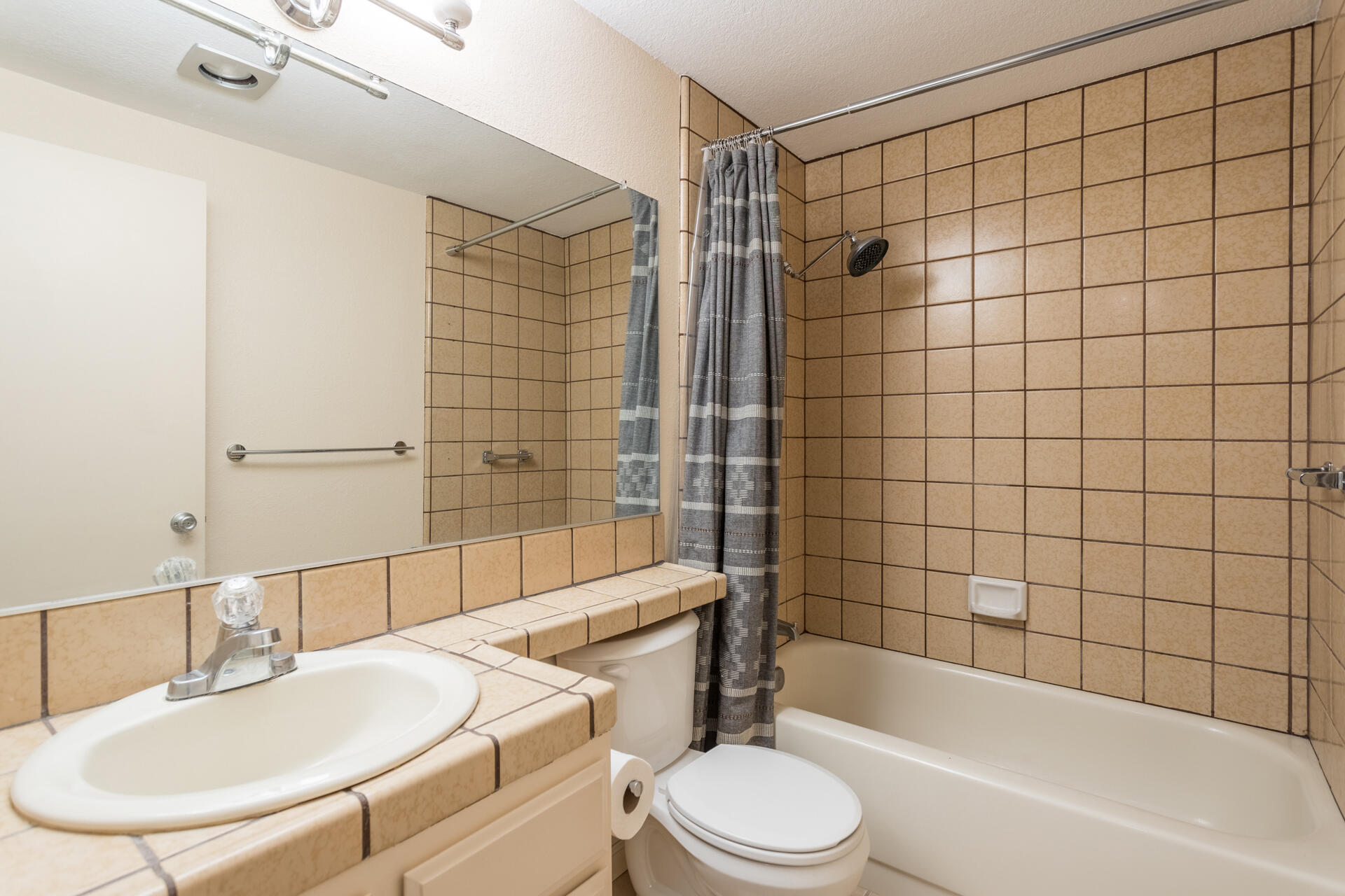 466 Ridgecrest Trail, Unit 136 Redding, CA 96003 - Photo 11 of 16 a bathroom with a bathtub a sink toilet and shower