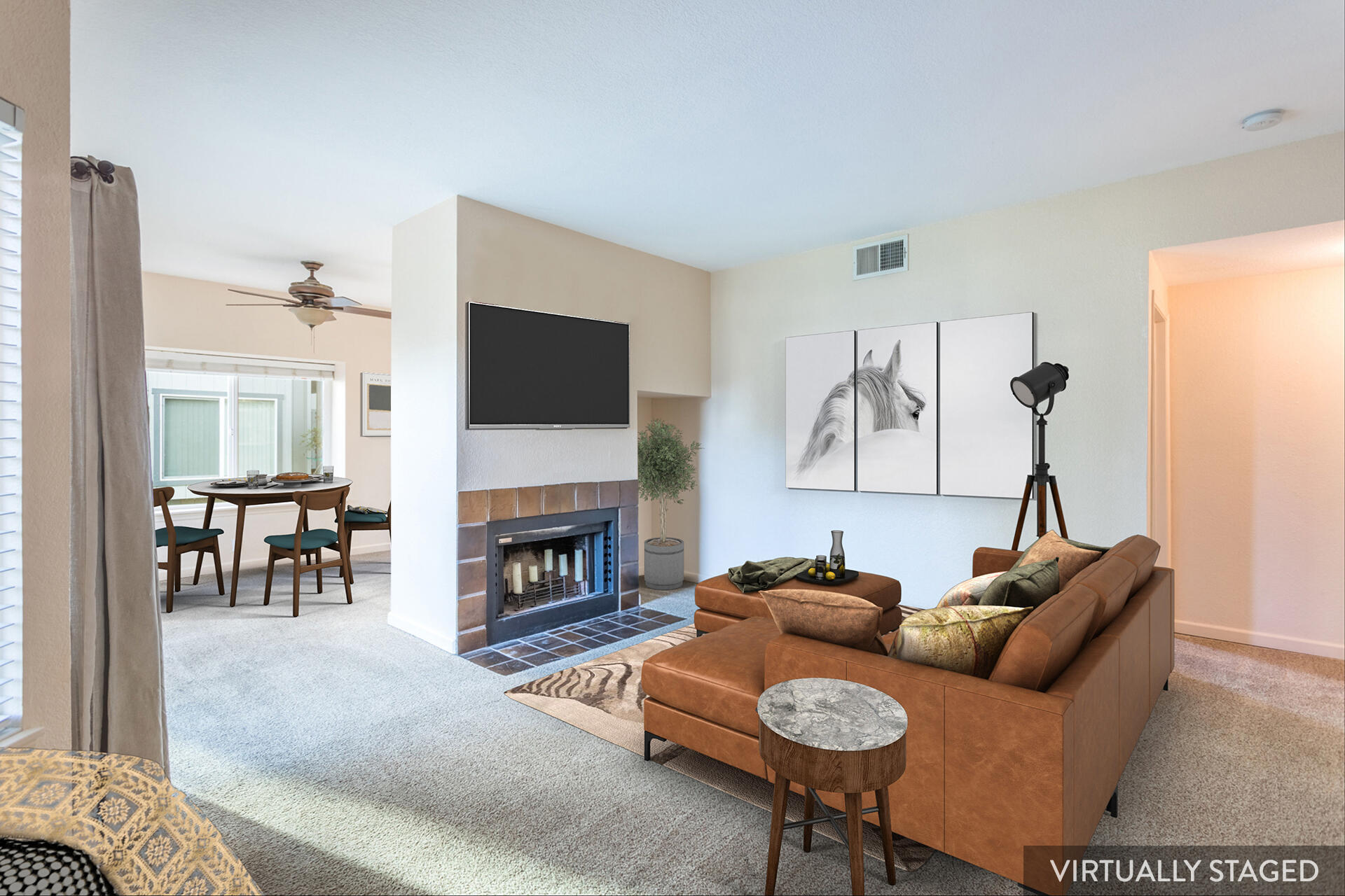 466 Ridgecrest Trail, Unit 136 Redding, CA 96003 - Photo 2 of 16 a living room with furniture a flat screen tv and a fireplace
